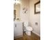 This half bath features a modern vanity, new fixtures, and beautiful neutral paint at 6845 S Webster St # E, Littleton, CO 80128