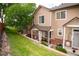 Charming townhome featuring a welcoming entrance and well-maintained landscaping at 6845 S Webster St # E, Littleton, CO 80128