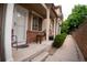 Charming home with covered front porch, brick accents and well maintained landscaping at 6845 S Webster St # E, Littleton, CO 80128