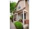 Charming home with covered front porch, brick accents and well maintained landscaping at 6845 S Webster St # E, Littleton, CO 80128