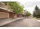 Row of attached garages on a tree lined street in a quiet neighborhood at 6845 S Webster St # E, Littleton, CO 80128