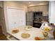 Bright kitchen with updated appliances, neutral cabinets, and stylish backsplash at 6845 S Webster St # E, Littleton, CO 80128