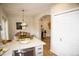 Bright kitchen featuring stainless steel appliances, granite countertops, and an adjacent dining area at 6845 S Webster St # E, Littleton, CO 80128