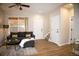 Bright living room featuring a comfortable sofa and access to staircase at 6845 S Webster St # E, Littleton, CO 80128