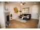 Stylish living room with fireplace, decor, and ample natural light at 6845 S Webster St # E, Littleton, CO 80128