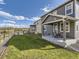Beautiful backyard with a covered patio and lush green lawn, ideal for outdoor activities and relaxation at 917 White Leaf Cir, Castle Rock, CO 80108