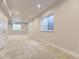 Carpeted basement with two egress windows and access to storage space, perfect for customized living at 917 White Leaf Cir, Castle Rock, CO 80108
