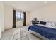 Bright bedroom featuring a bed and a large window, providing ample natural light at 917 White Leaf Cir, Castle Rock, CO 80108