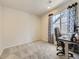Bright bedroom featuring a desk and a large window, providing ample natural light at 917 White Leaf Cir, Castle Rock, CO 80108