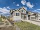 A cozy home with a fenced yard, complemented by lush green grass, under a beautiful blue sky at 917 White Leaf Cir, Castle Rock, CO 80108