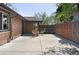 Brick house features a paved patio area with wicker outdoor furniture at 3025 Forest St, Denver, CO 80207