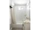 Bathroom features white marble tile, tub, shower and updated vanity at 3025 Forest St, Denver, CO 80207
