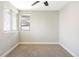 Bright, carpeted bedroom with neutral walls and a large window at 3025 Forest St, Denver, CO 80207