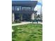 Exterior view of a restaurant in Fairfax Park, with outdoor seating and green space at 3025 Forest St, Denver, CO 80207