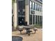 Exterior view of establishment with a wine bar sign and outdoor seating area at 3025 Forest St, Denver, CO 80207