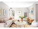 Bright, neutral living room with large windows, stylish decor, and comfortable seating at 3025 Forest St, Denver, CO 80207