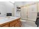 Bathroom with shower, toilet, vanity and shelves at 31042 Wildwoods, Evergreen, CO 80439