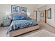 Comfortable bedroom with a plush bed, blue accents, and an en-suite bathroom at 31042 Wildwoods, Evergreen, CO 80439