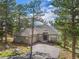 Lovely home featuring stone accents, a two-car garage, and a well-maintained driveway at 31042 Wildwoods, Evergreen, CO 80439