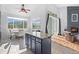 Eat-in kitchen featuring a center island, granite countertops, and sliding glass doors to the backyard at 31042 Wildwoods, Evergreen, CO 80439