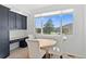 Sunlit kitchen nook with mountain views, desk space, and a small table at 31042 Wildwoods, Evergreen, CO 80439