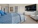 Bright main bedroom features a large television, chair and a comfortable king-sized bed at 31042 Wildwoods, Evergreen, CO 80439