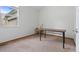 Small office space with carpet, natural light, and a simple desk with printer at 31042 Wildwoods, Evergreen, CO 80439