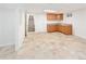 Basement area features tile floors, cabinetry, and access to stairs at 6463 S Vance St, Littleton, CO 80123
