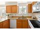 Efficient kitchen features light wood cabinets, granite countertops, and stainless steel appliances for convenient cooking at 6463 S Vance St, Littleton, CO 80123