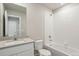 This bathroom features a shower and tub combination along with a contemporary-style vanity at 48255 Shetland Dr, Bennett, CO 80102