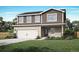 Charming two-story home with a well-manicured lawn, two car garage and inviting curb appeal at 48255 Shetland Dr, Bennett, CO 80102