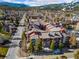 Scenic aerial view of condos, highlighting surrounding mature trees, neighborhood, and mountainous backdrop at 107 N Harris St # 102, Breckenridge, CO 80424