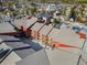 Aerial view of red condo building in town, showcasing its unique architecture and surrounding community at 107 N Harris St # 102, Breckenridge, CO 80424