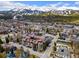 Beautiful aerial view of condo building, capturing mountain views, parking, and neighborhood setting at 107 N Harris St # 102, Breckenridge, CO 80424