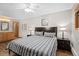 Comfortable bedroom features a queen-sized bed, dark furniture, and carpeted floors at 107 N Harris St # 102, Breckenridge, CO 80424