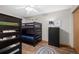 bedroom featuring bunk beds, wood-look floors, and a ceiling fan at 107 N Harris St # 102, Breckenridge, CO 80424