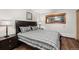 Comfortable bedroom with a queen-sized bed, dark furniture, and a window with natural light at 107 N Harris St # 102, Breckenridge, CO 80424