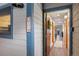 Inviting condo entryway featuring unit number, wreath, and wood flooring at 107 N Harris St # 102, Breckenridge, CO 80424