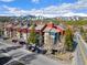 Scenic exterior of a multi-story building with a mountain view, parking and road at 107 N Harris St # 102, Breckenridge, CO 80424