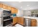 Bright kitchen featuring stainless appliances, wood cabinets, and sleek countertops at 107 N Harris St # 102, Breckenridge, CO 80424