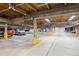 Large parking garage with ample parking spaces and yellow safety poles at 107 N Harris St # 102, Breckenridge, CO 80424