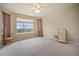 Spacious bedroom with a ceiling fan, carpeted floor and large windows offering lots of natural light at 925 Antelope W Dr, Bennett, CO 80102