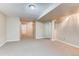 Spacious finished basement with plush carpeting, recessed lighting, and ample room for recreation and relaxation at 87 Macon Ct, Aurora, CO 80010