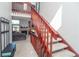 Bright entryway featuring a staircase, open living room with a fireplace, and neutral decor at 87 Macon Ct, Aurora, CO 80010