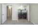 Enclosed laundry area with appliances and storage shelving at 87 Macon Ct, Aurora, CO 80010