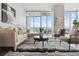 Living room with modern furniture and city views at 891 14Th St # 1201, Denver, CO 80202