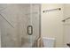 Tiled shower stall featuring built-in bench and frameless glass door at 3131 E Alameda Ave # 704, Denver, CO 80209