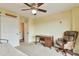 Spacious bedroom featuring neutral carpet, ceiling fan, and closet at 3131 E Alameda Ave # 704, Denver, CO 80209