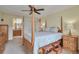 Bedroom with a four-poster bed, ensuite, and built-in night stands at 3131 E Alameda Ave # 704, Denver, CO 80209