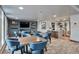 Well-lit dining area with seating for eight, complemented by modern fixtures and artwork at 3131 E Alameda Ave # 704, Denver, CO 80209